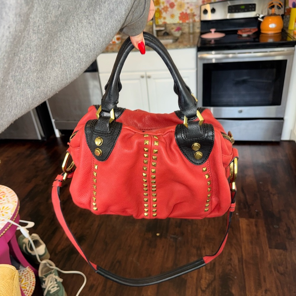 Stylish Red Handbag with Black Accents